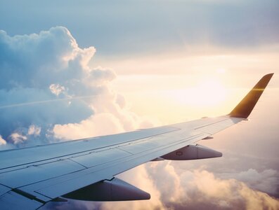 A plane in flight going through clouds